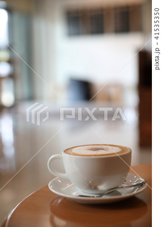 cappuccino or Latte art coffee made from milk on the wood table in coffee shop cappuccino or Latte art coffee made from milk on the wood table in coffee shop 41535350