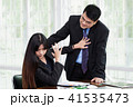 Man molesting women employee in the office. 41535473