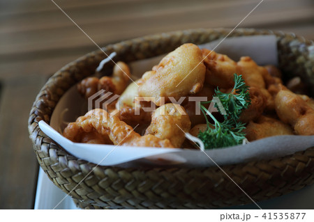Calamari rings , fried squid on wood background , Italian food Calamari rings , fried squid on wood background , Italian food 41535877