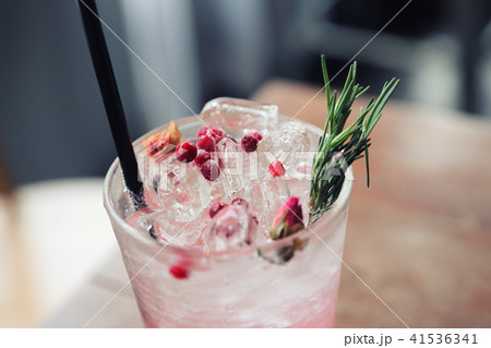 Strawberry juice cocktail with soda on wood background Strawberry juice cocktail with soda on wood background 41536341