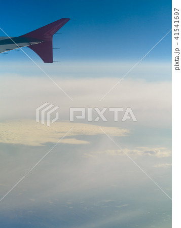 Beautiful white clouds and blue sky from plane Beautiful white clouds and blue sky from plane 41541697