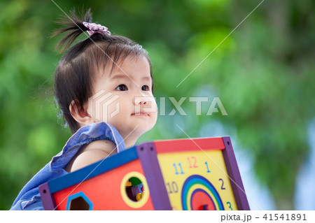 Cute asian baby girl playing with her toy Cute asian baby girl playing with her toy 41541891