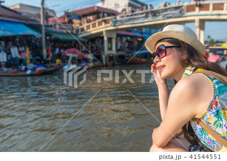 modern lady wearing sunglasses and sitting modern lady wearing sunglasses and sitting 41544551