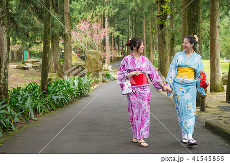 woman holding their hands and taking a walk woman holding their hands and taking a walk 41545866
