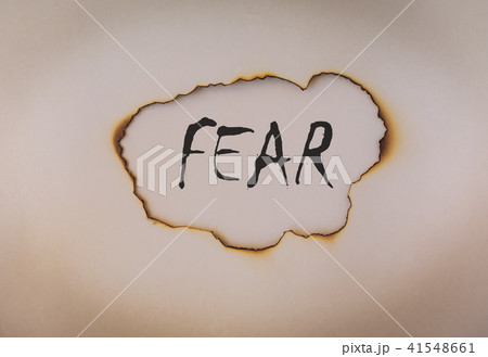 Fear concept, word on burnt paper 41548661