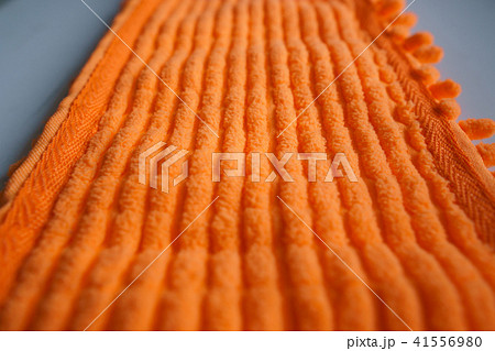 Orange color microfiber cleaning material texture, closeup shoot. Orange color microfiber cleaning material texture, closeup shoot. 41556980