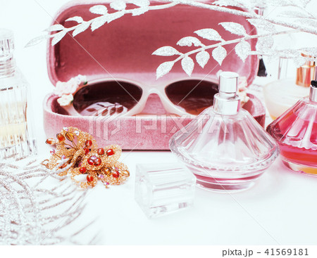 Jewelry table with lot of girl stuff on it, little mess in cosmetic brushes, women interior concept 41569181