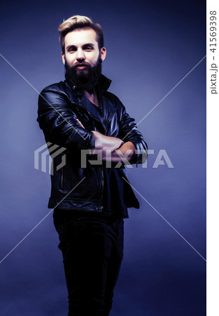 portrait of young bearded hipster guy on gray dark background cl 41569398