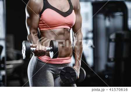 strong sexy athletic young girl working out in gym strong sexy athletic young girl working out in gym 41570616