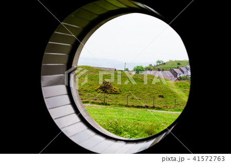 Green grass on the meadow field with sea in the 41572763
