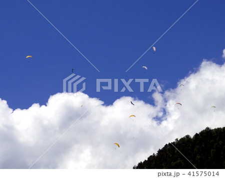 paragliding, parachute over the mountain paragliding, parachute over the mountain 41575014