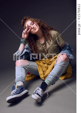 Happy hippy girl, studio shot Happy hippy girl, studio shot 41576811