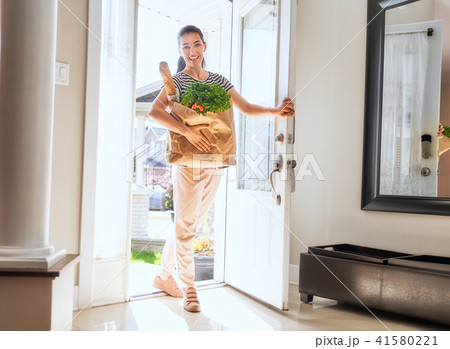 woman holding grocery shopping bag woman holding grocery shopping bag 41580221