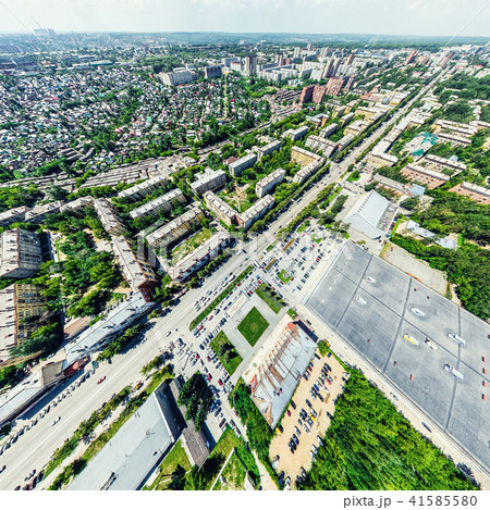 Aerial city view with crossroads and roads, houses, buildings, parks and parking lots. Sunny summer Aerial city view with crossroads and roads, houses, buildings, parks and parking lots. Sunny summer 41585580