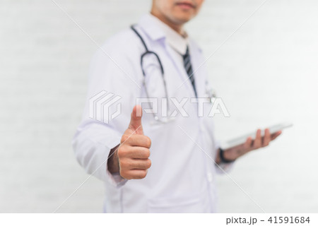 doctor using digital tablet on white background 41591684