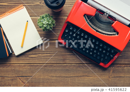 Vintage typewriter on wooden background Vintage typewriter on wooden background 41595622