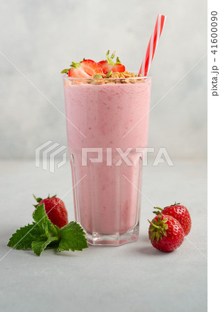 Strawberry milkshake on a gray concrete background 41600090