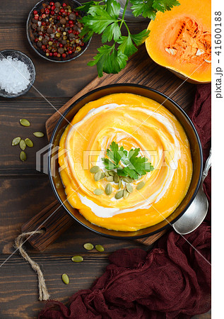 Pumpkin soup with cream and parsley. 41600188