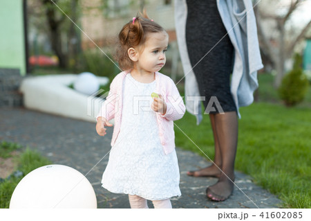 little girl child playing on the lawn 41602085