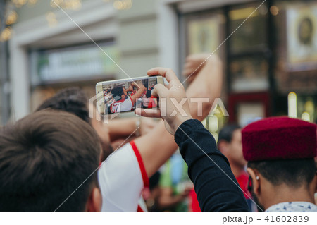 man takes to the phone happy football fans in Moscow 2018 man takes to the phone happy football fans in Moscow 2018 41602839
