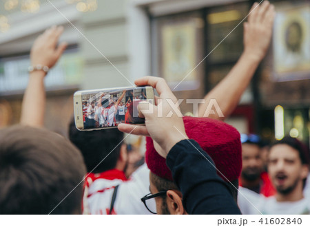 man takes to the phone happy football fans in Moscow 2018 41602840