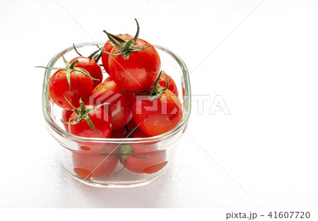Sweet tomatoes in glass container Sweet tomatoes in glass container 41607720