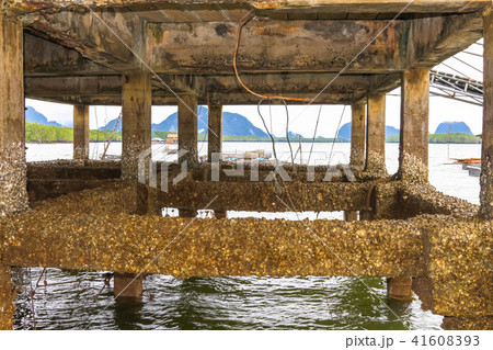 under pier in fishing village 41608393