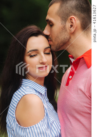 A guy and a girl enjoy each other in a romantic atmosphere A guy and a girl enjoy each other in a romantic atmosphere 41613627