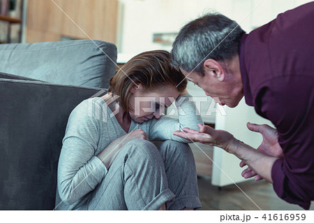 Aggressive husband beating his young wife 41616959