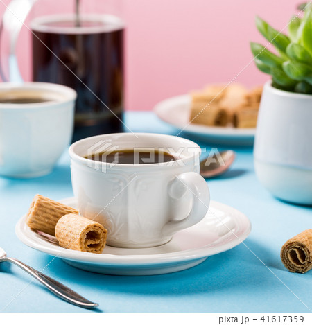 Two cups of coffee with wafer rools Two cups of coffee with wafer rools 41617359