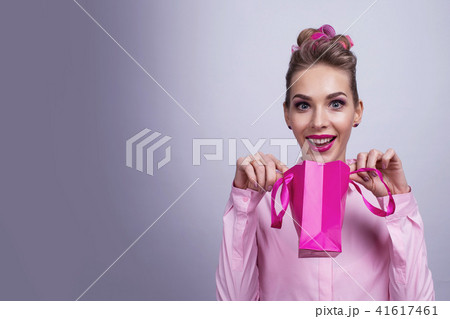 Woman with small shopping bag Woman with small shopping bag 41617461