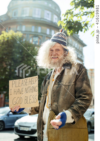 Homeless wearing old brown leather jacket Homeless wearing old brown leather jacket 41619981
