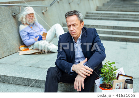 Dismissed office manager sitting on the stairs Dismissed office manager sitting on the stairs 41621058
