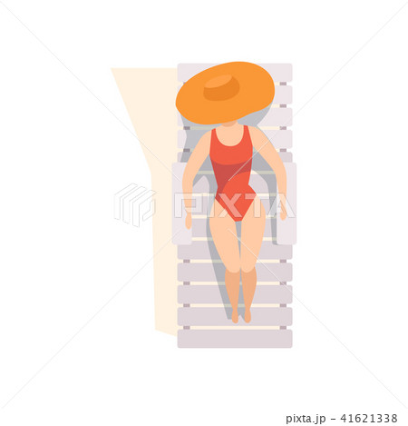 Beautiful young woman in straw hat and red swimsuit sunbathing on the beach, top view of sitting 41621338