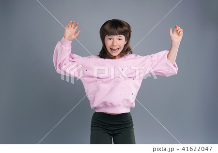 Cute teenage girl jumping happily and celebrating Cute teenage girl jumping happily and celebrating 41622047