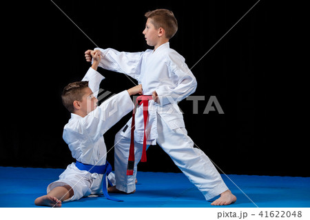 two boys training karate kata exercises at test qualification two boys training karate kata exercises at test qualification 41622048