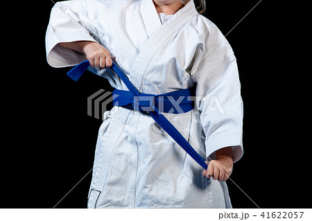 sweet little girl in martial arts practice like karate kid alone isolated on black background sweet little girl in martial arts practice like karate kid alone isolated on black background 41622057