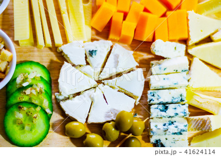 set of different cheeses on a wooden board 41624114