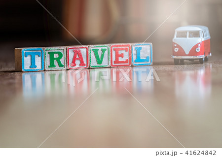 Small toy car and wooden blocks spelling travel Small toy car and wooden blocks spelling travel 41624842