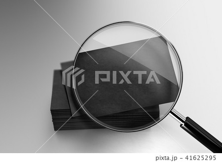 Blank black business cards stack mockup under the magnifying glass Blank black business cards stack mockup under the magnifying glass 41625295
