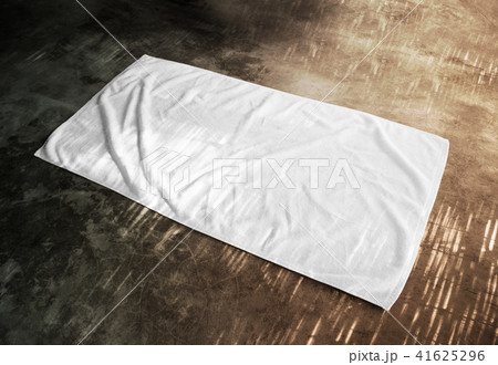 Blank white beach towel mockup on textured floor 41625296