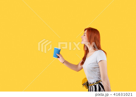 Cheerful positive woman having a coffee cup in her hands Cheerful positive woman having a coffee cup in her hands 41631021