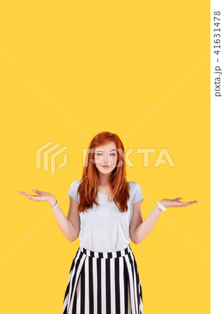 Happy attractive woman holding her hands up 41631478