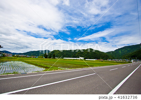 田んぼと道路 田舎3の写真素材