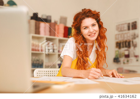 Creative young artist working in light art studio 41634162