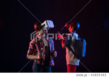 Inspired girl wearing a VR headset Inspired girl wearing a VR headset 41635163