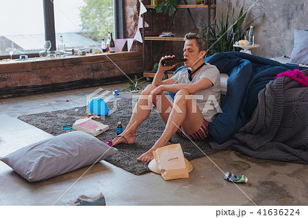 Tired mature man drinking alcohol 41636224