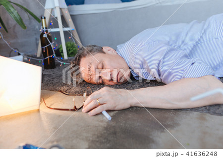 Drunk mature man having alcoholism 41636248