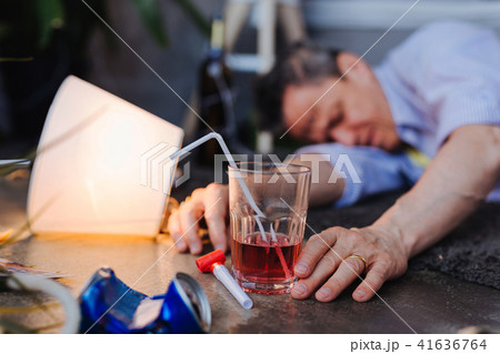 Sleepy mature man showing alcoholism symptoms 41636764