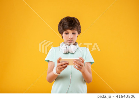 Amazed boy using his modern phone 41643806